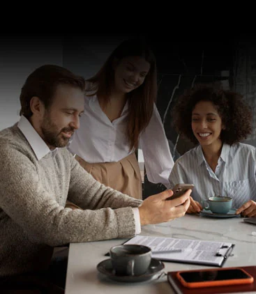 Coworkers at a table in a cool office